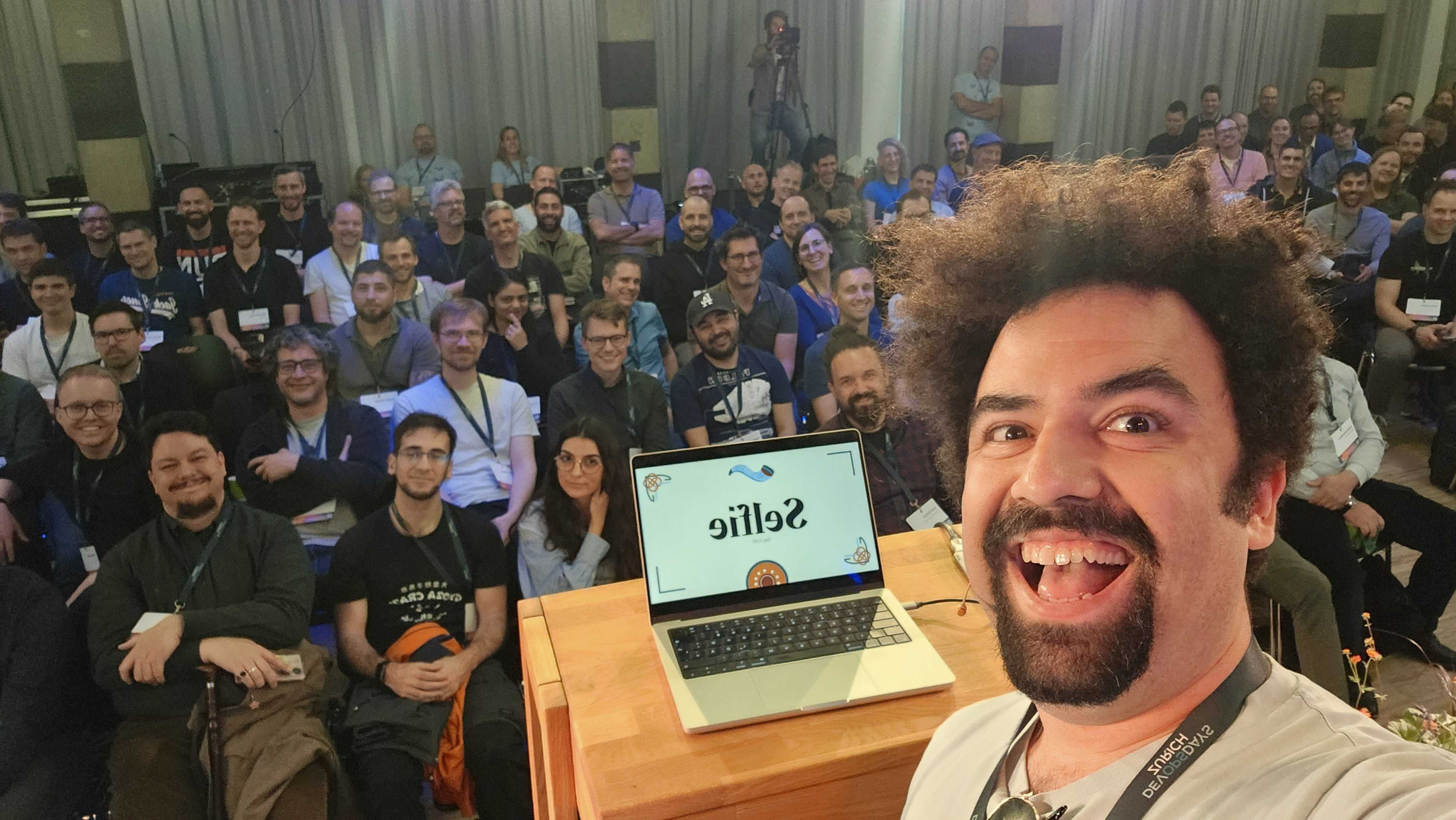 Selfie with the audience after Beyond SBOMs at DevOpsDays Zurich 2026.