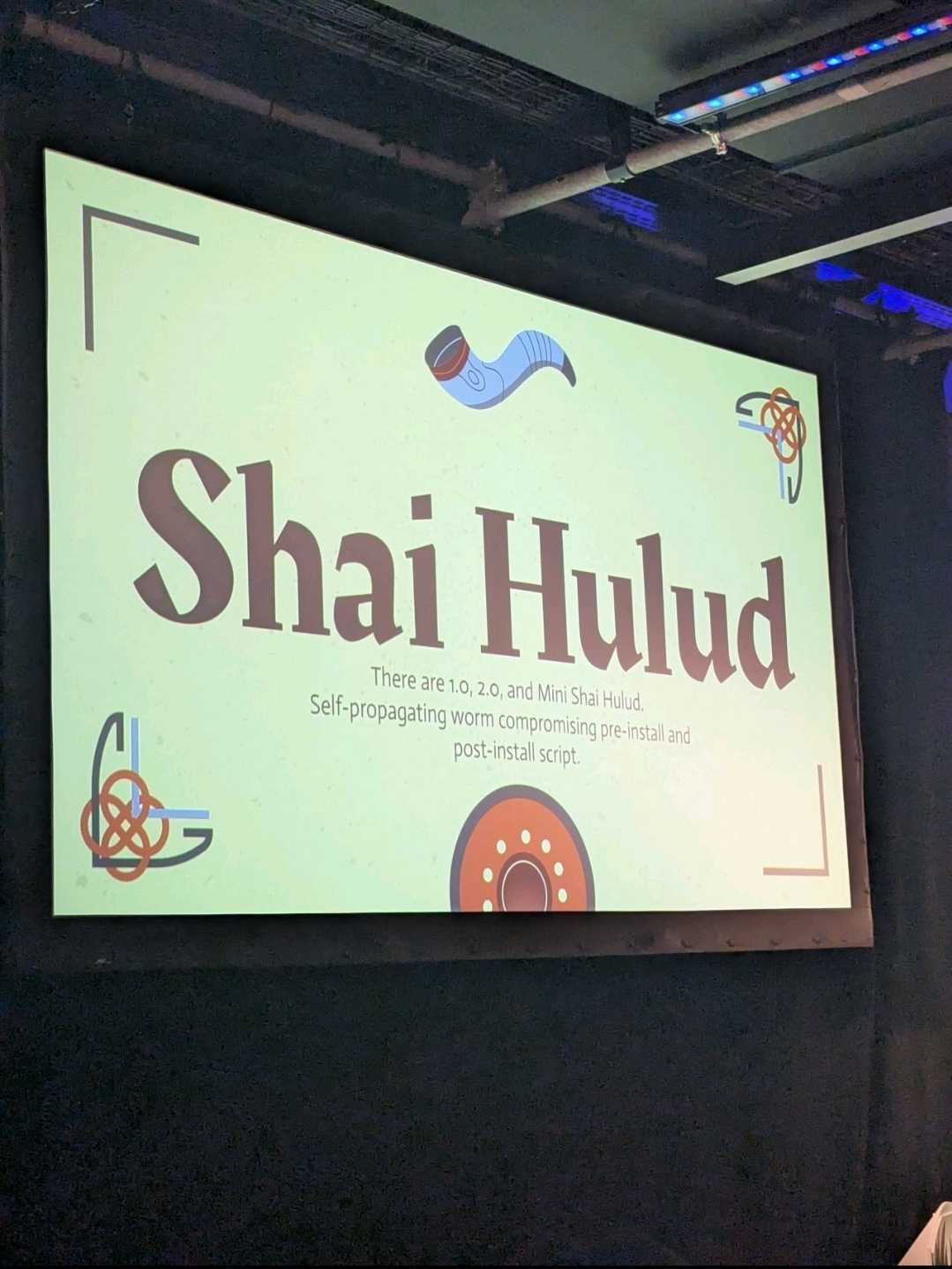 Audience view of the DevOpsDays Zurich talk slides mentioning Shai-Hulud.